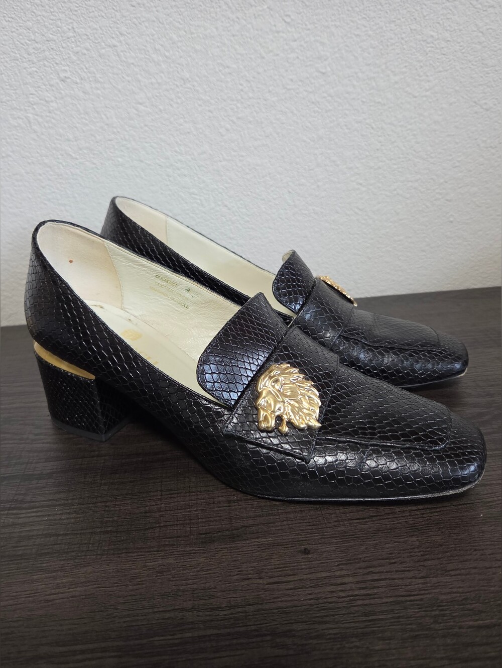 Bruno Magli Black Textured Loafers With Gold Lion Head Accent